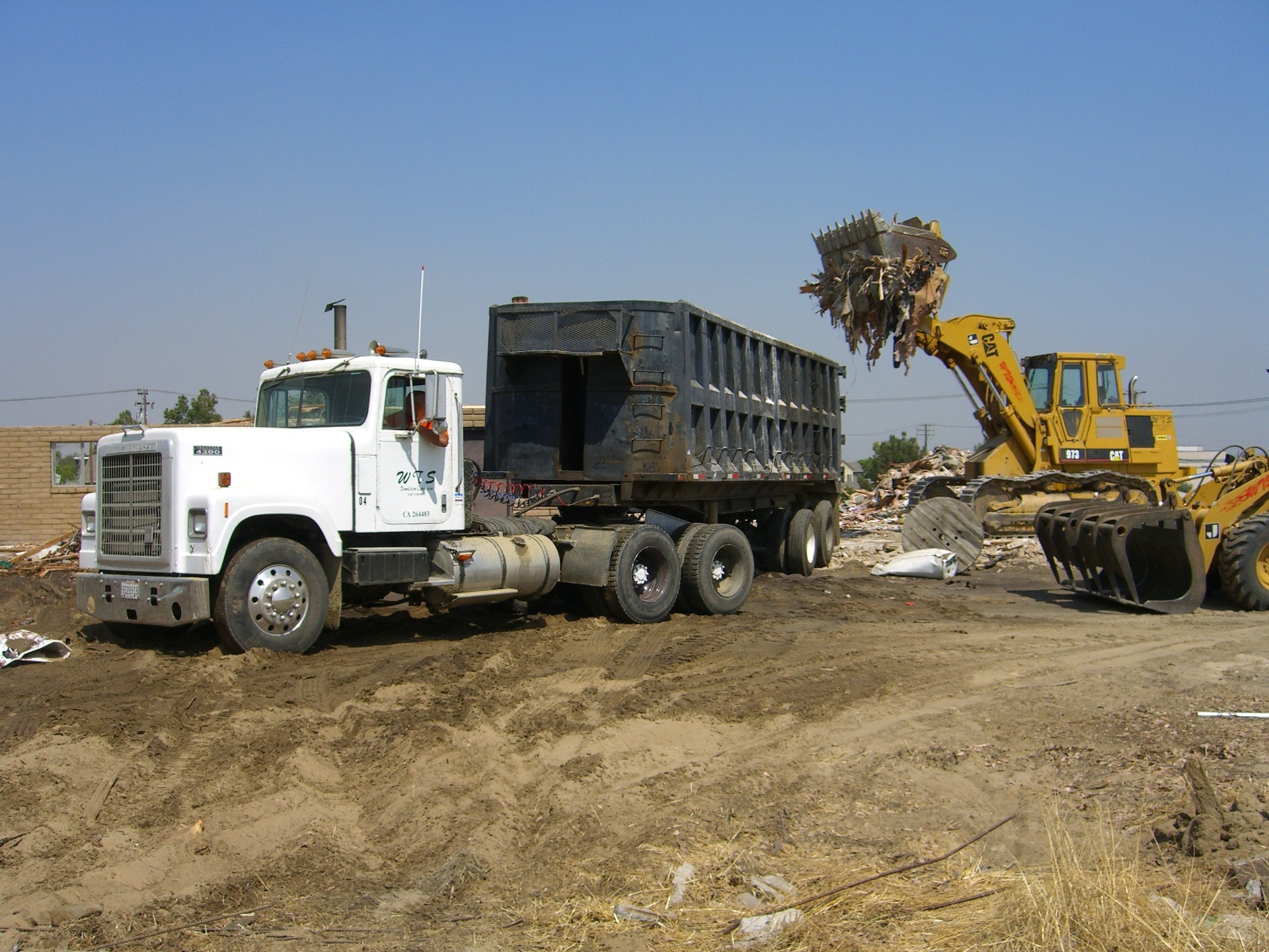 Lot clearing, loading debris into container