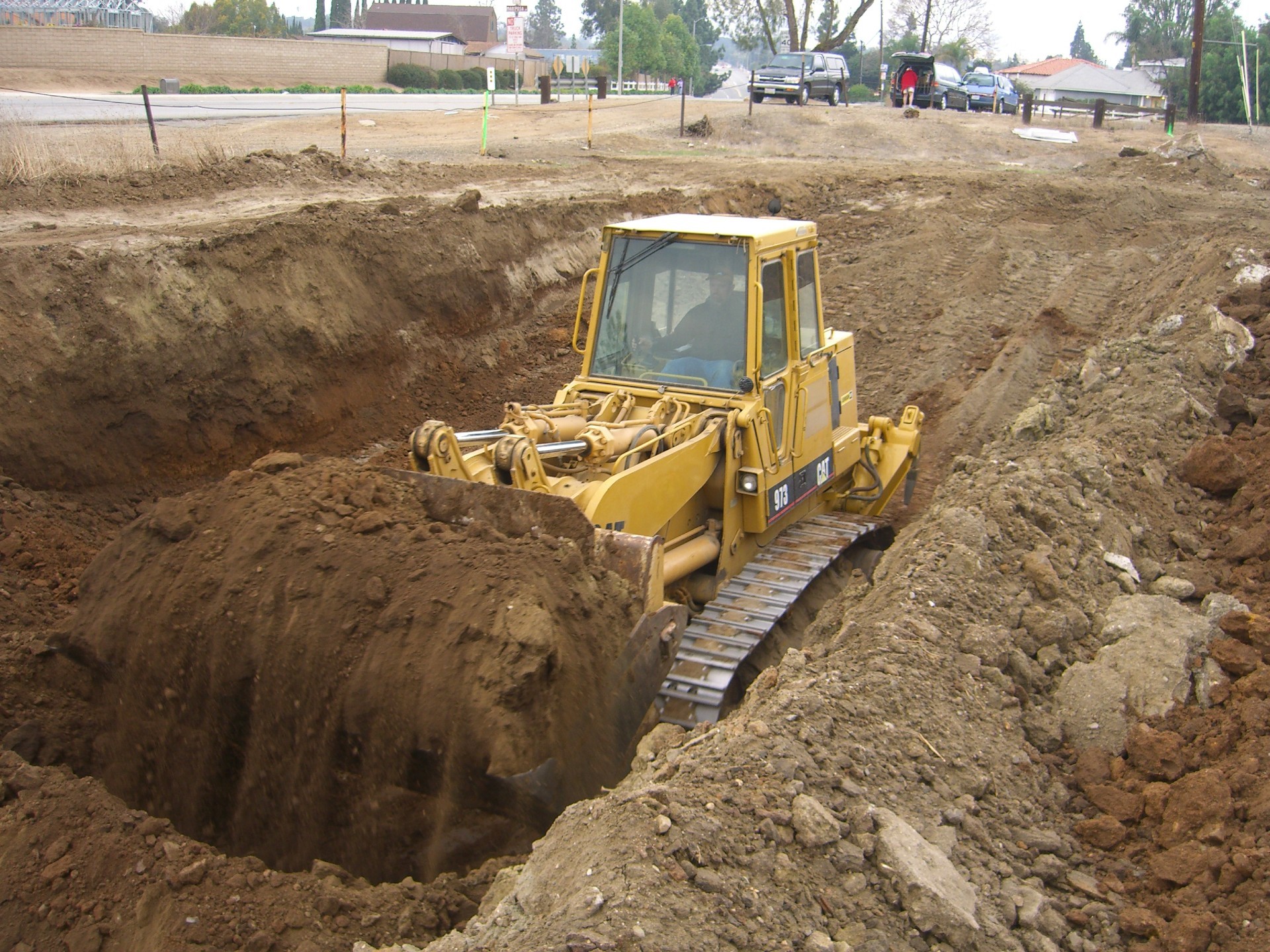 Dirt Removal with Big Caterpillar Tractor